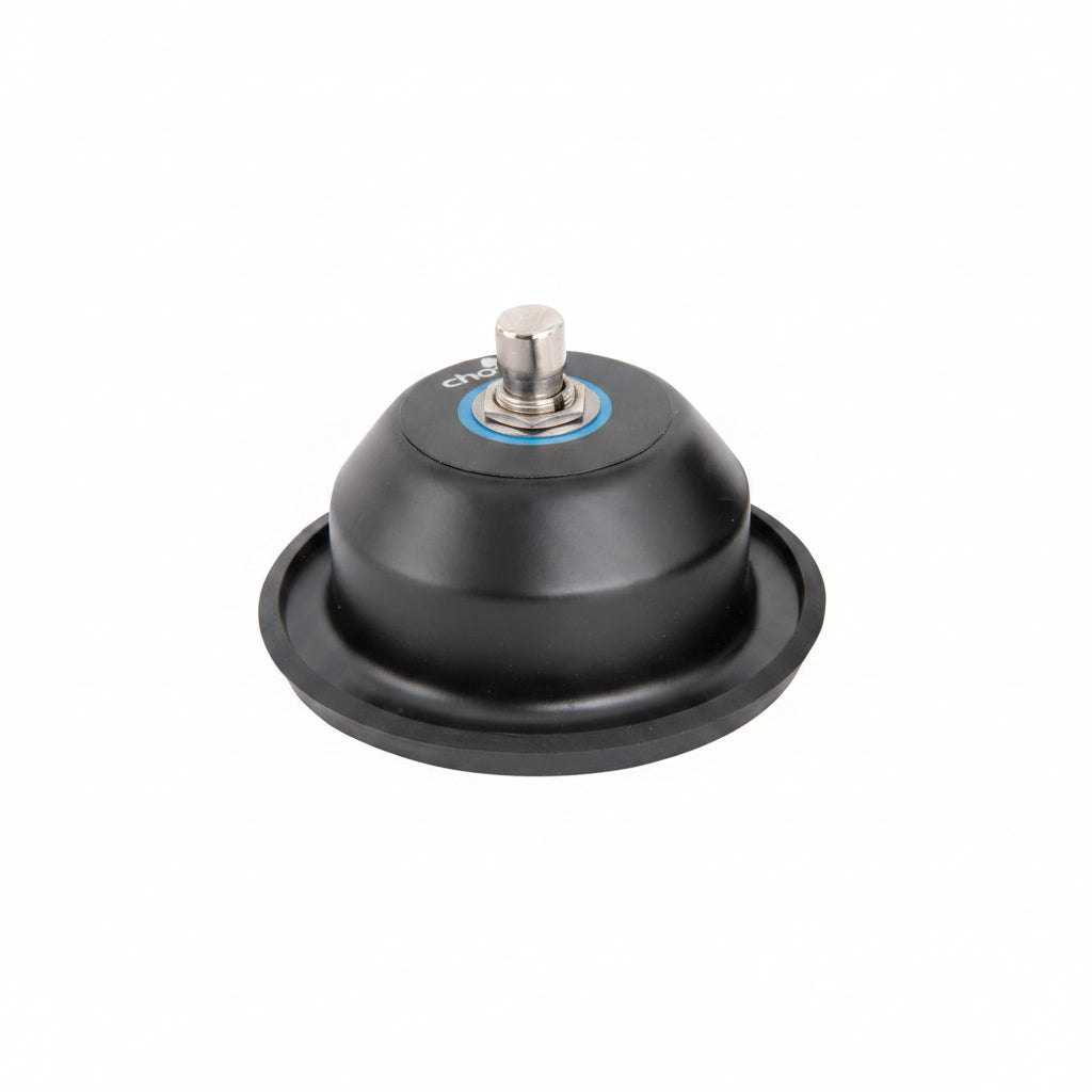 Black and silver round pedal with a single silver button in the middle. With chord brand printed on the tor and rubber base