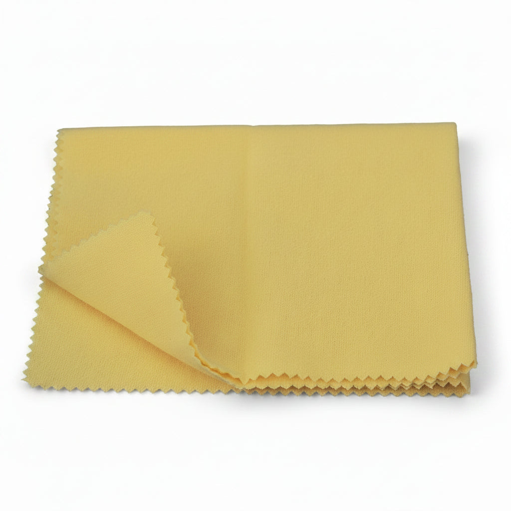 Yellow microfiber cloth on a white background