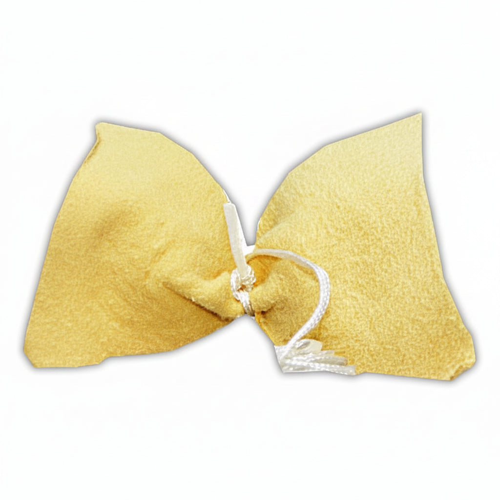 This yellow pull through is made of absorbent fabric attached to a cord to pull it through the instruments.