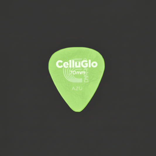 A single translucent Celluloid 70mm guitar pick with silver printed branding and size markings, placed on a dark textured surface.