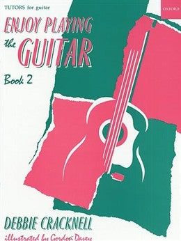 Book cover of 'Enjoy Playing the Guitar Book 2' by Debbie Cracknell with a pink guitar illustration on a green background.
