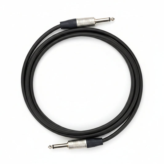 Guitar cable with jack to jack plugs on a white background