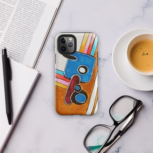 Phone case with colourful abstract design on a marble surface with a book, pen, and coffee cup.