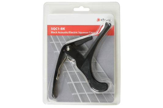 Black acoustic/electric guitar capo in packaging with brand label