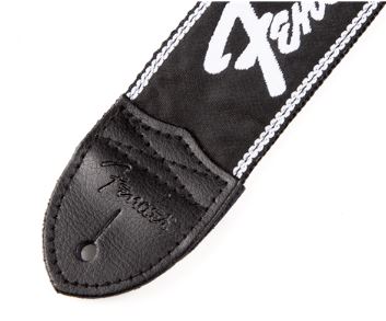 Close-up of a Fender guitar strap with logo on a white background