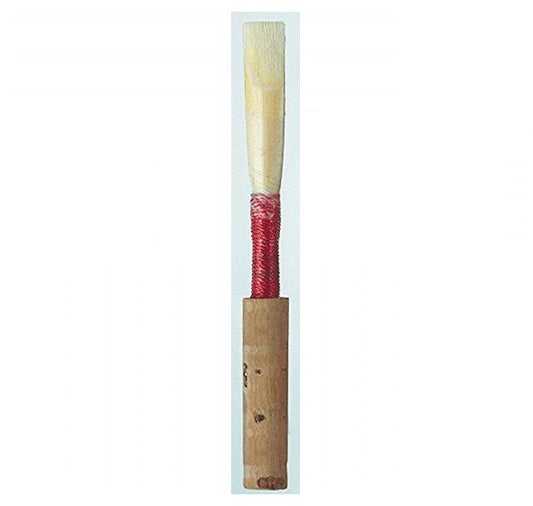 Wooden reed with red wrap and cork a white background