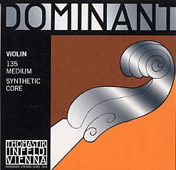 Violin string with 'Dominant' branding on an orange and black background