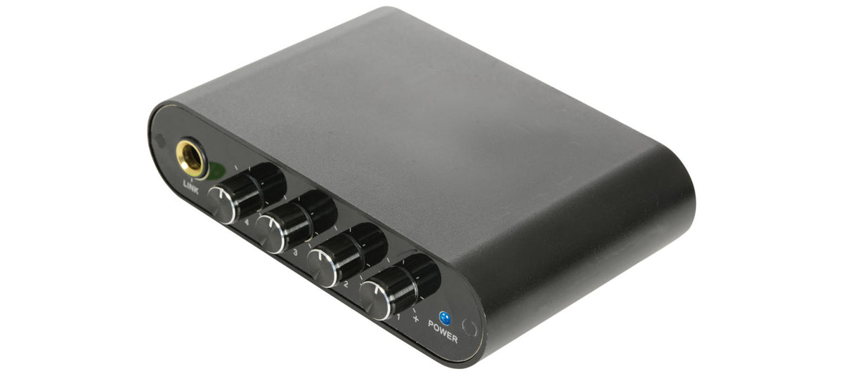 Black headphone amplifier with multiple ports on a white background