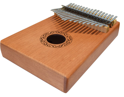 Wooden kalimba with metal tines on a white background