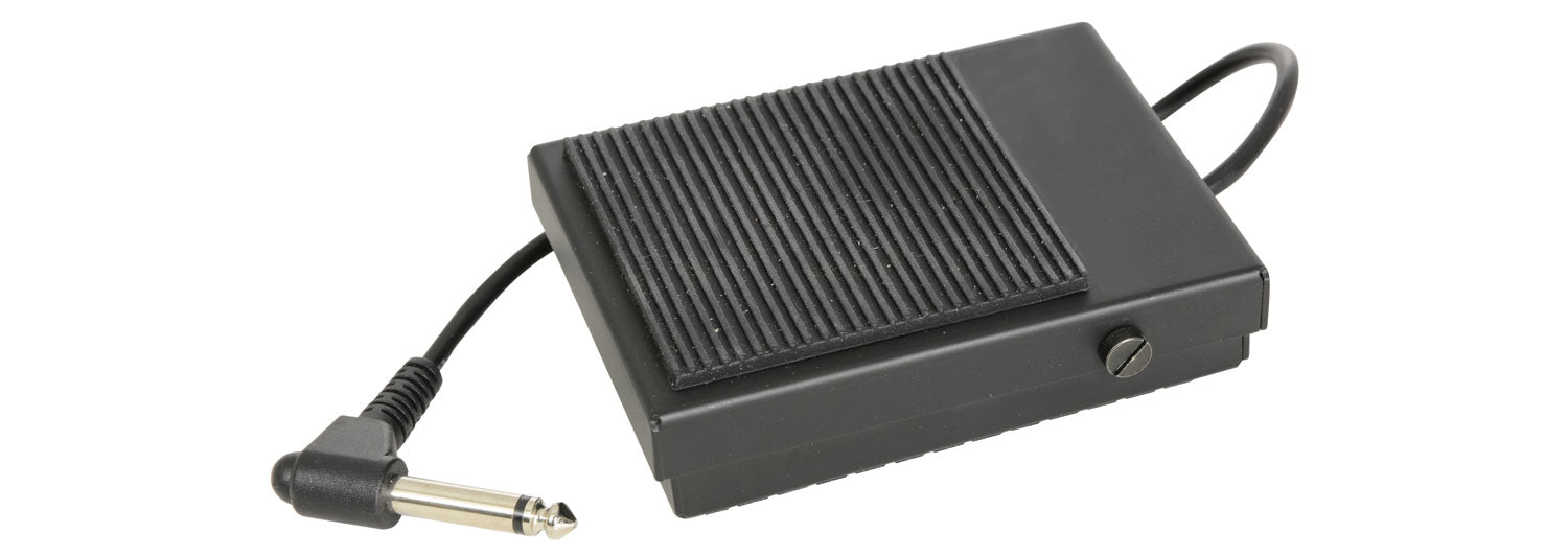 Black foot pedal with a cable on a white background