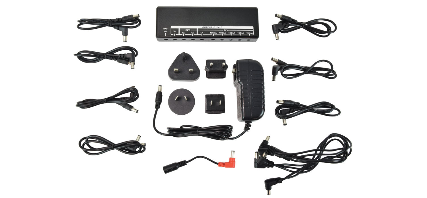 Collection of various power adapters and cables on a white background