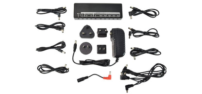 Collection of various power adapters and cables on a white background
