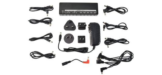 Collection of various power adapters and cables on a white background