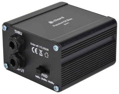 Black metal rectangular box with one thru jack socket and one input jack socket.  A plastic toggle-switch for 3 different decibel settings.