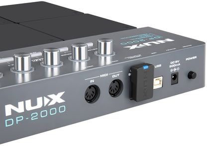 NUX DP-2000 musical device with control knobs and ports on a white background