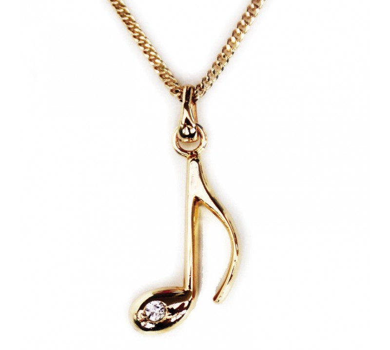 Gold plated necklace with a music note pendant on a white background