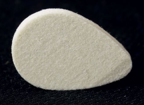 Felt plectrum with one side shaped for playability