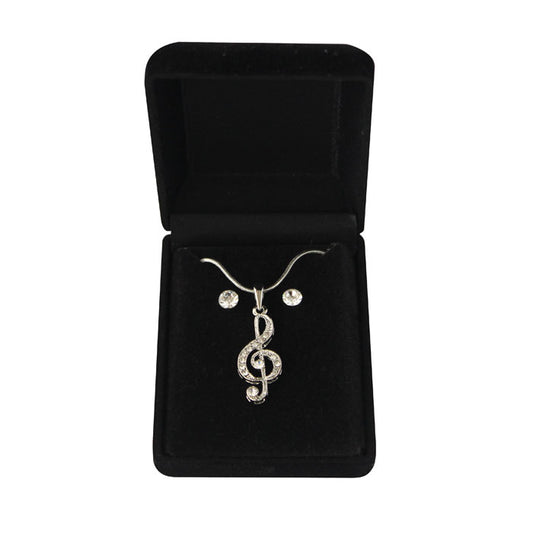 Necklace with a treble clef pendant in a black velvet box on a white background