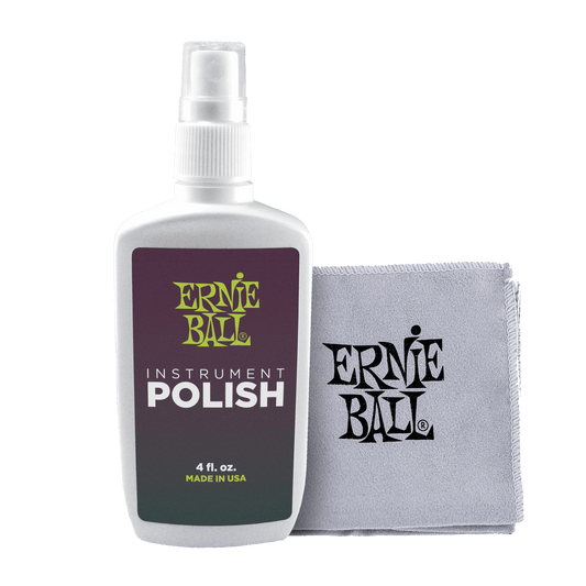 Ernie Ball instrument polish bottle and cloth on a black background