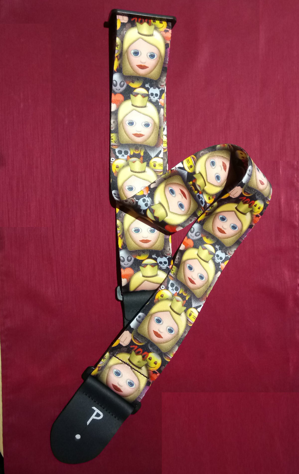 Guitar strap with cartoon character pattern on a red background