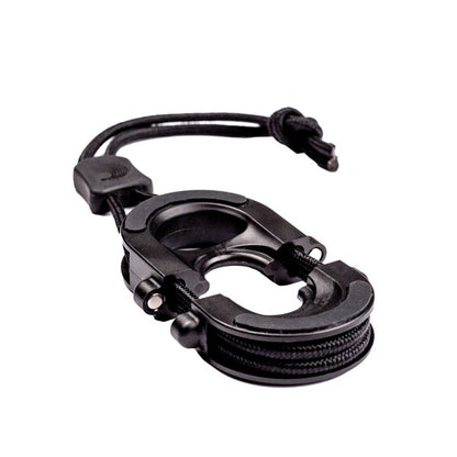Black plastic clip with ropes coiled on the outline on the device. 