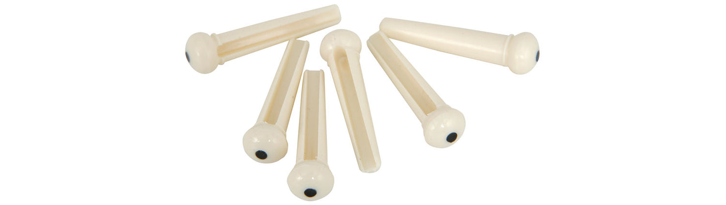 Set of acoustic guitar bridge pins on a white background
