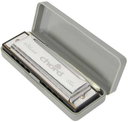 Chord harmonica in a gray case on a white background