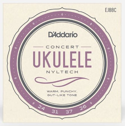 D'Addario concert ukulele string set packaging with purple and black design on a beige background