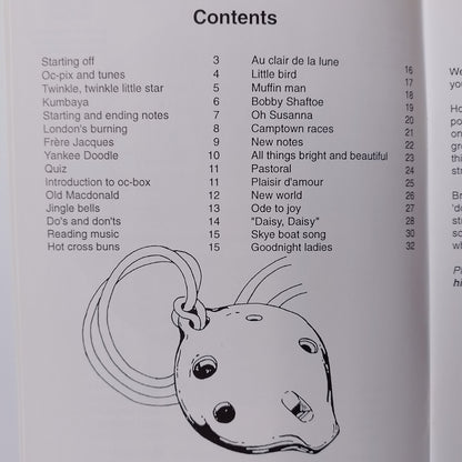 A printed table of contents page from a songbook or album, showing track titles, song numbers, and a simple line drawing of a ocarina.