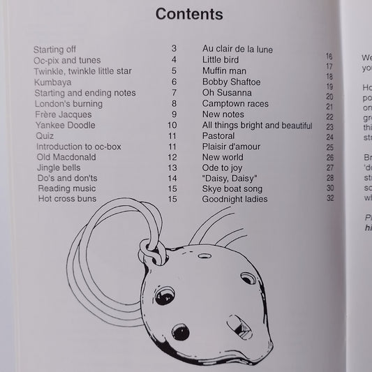 A printed table of contents page from a songbook or album, showing track titles, song numbers, and a simple line drawing of a ocarina.