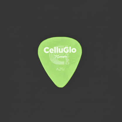 A single translucent Celluloid 70mm guitar pick with silver printed branding and size markings, placed on a dark textured surface.
