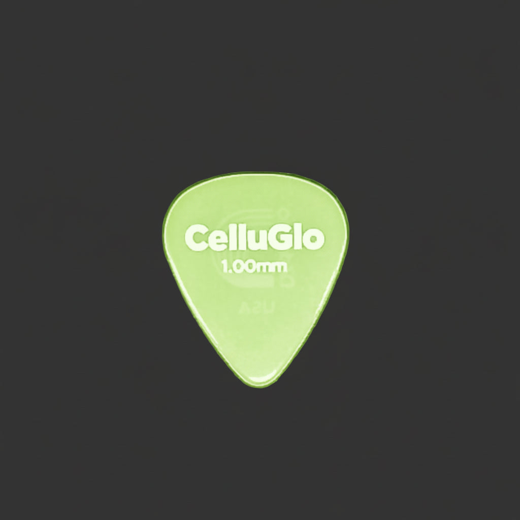 A single CelluGlo 1.00mm guitar pick on a textured dark gray background.