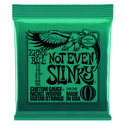 Ernie Ball Not Even Slinky guitar string packaging with green and black design.