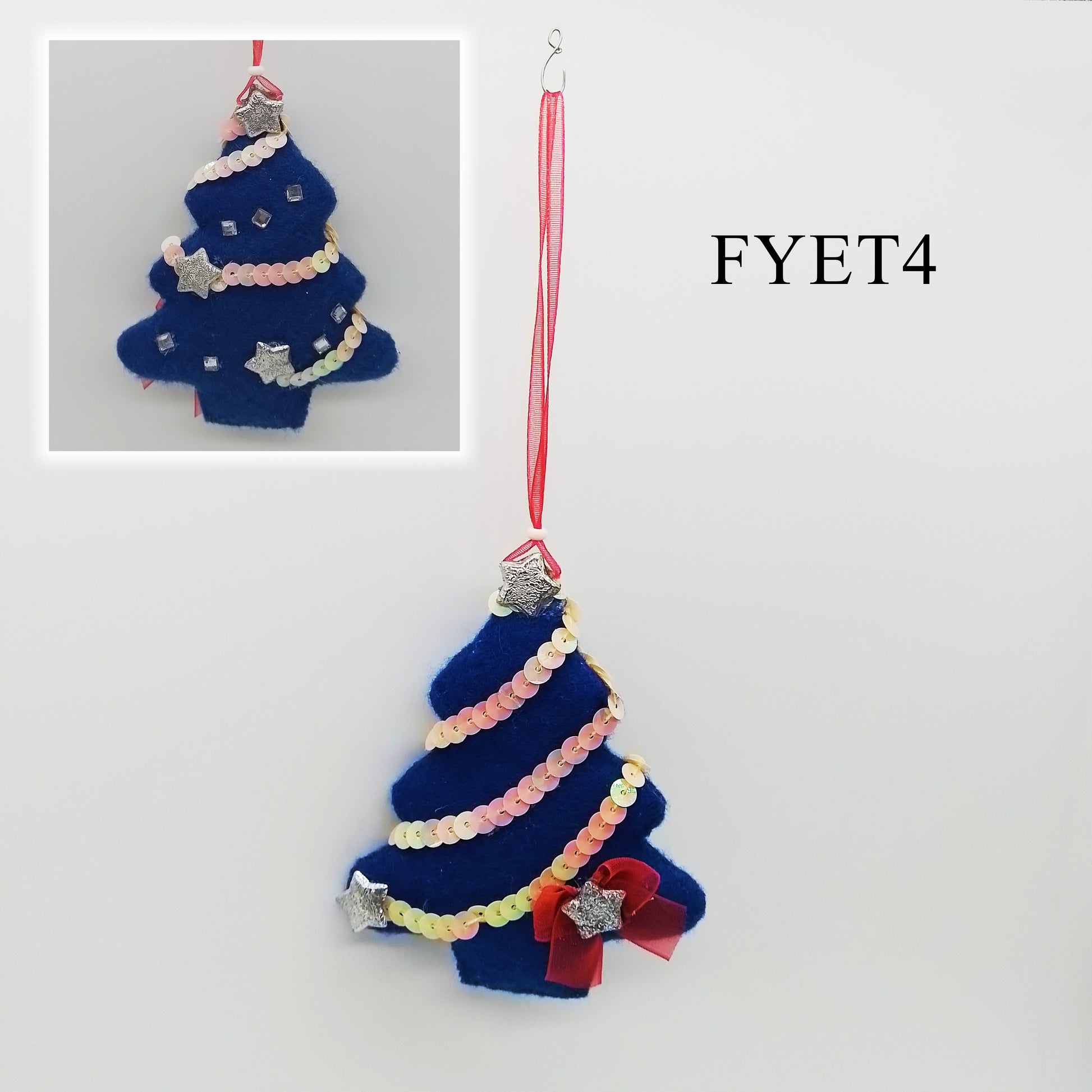 This unique and eye-catching decoration is made of blue felt and features a beautiful arrangement of sequins, silver stars, square crystal rhinestone and a striking red bow.