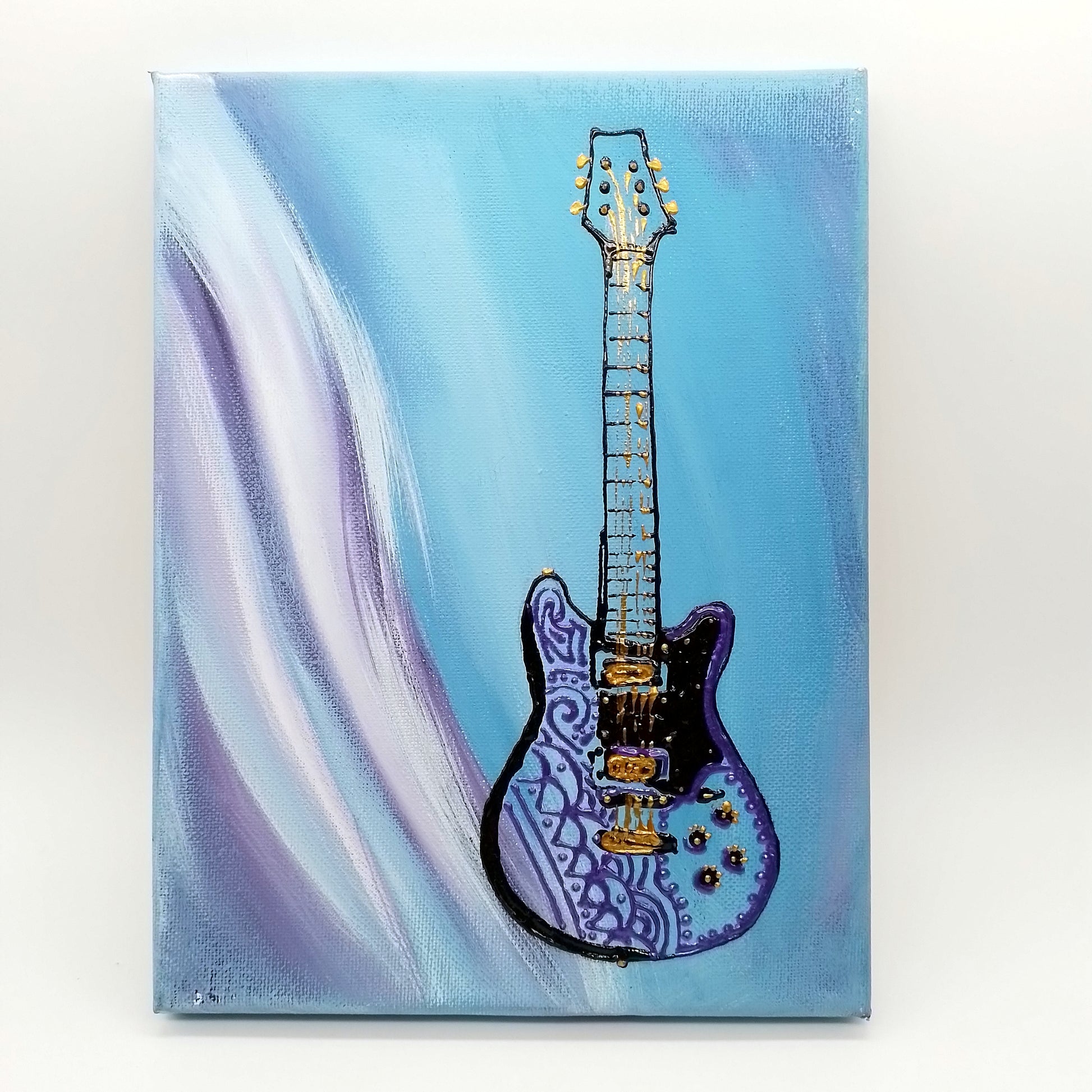 Black and purple electric guitar on blue white and purple background. The shape of the instrument is a light relief on a flat surface.