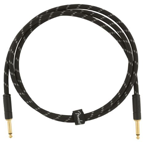 Fender guitar cable coiled on a white background