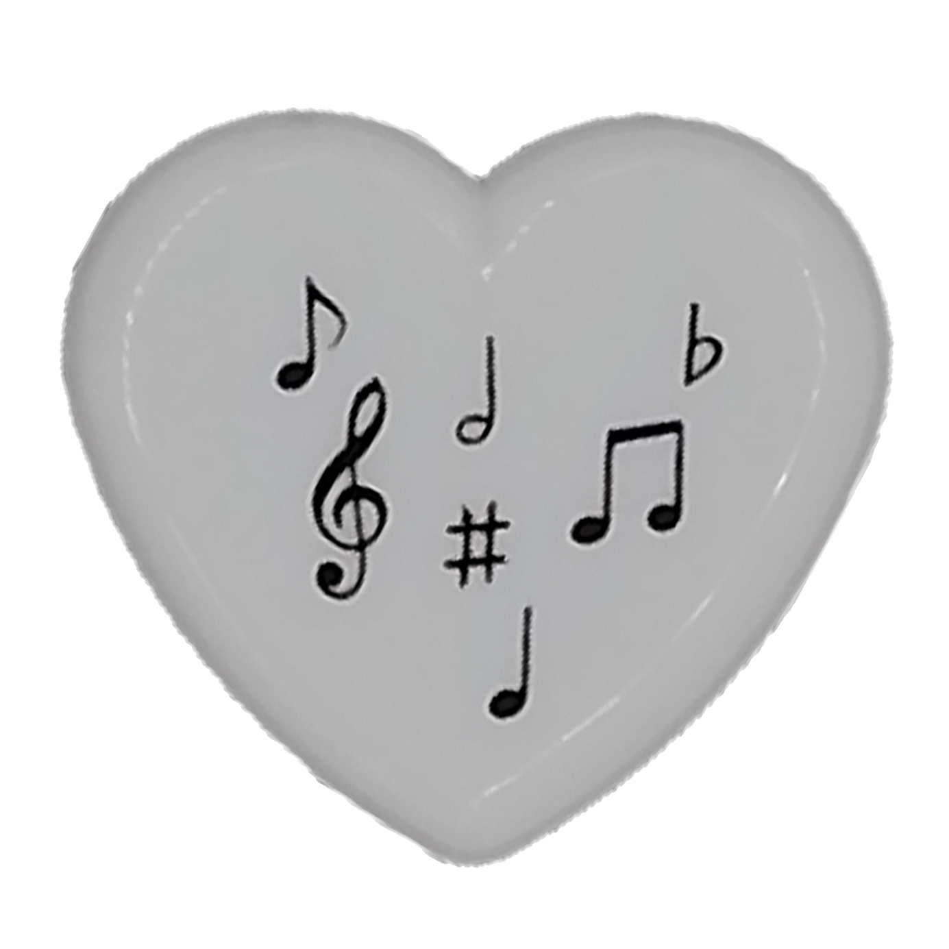 Heart-shaped pencil sharpener with musical symbols on a white background