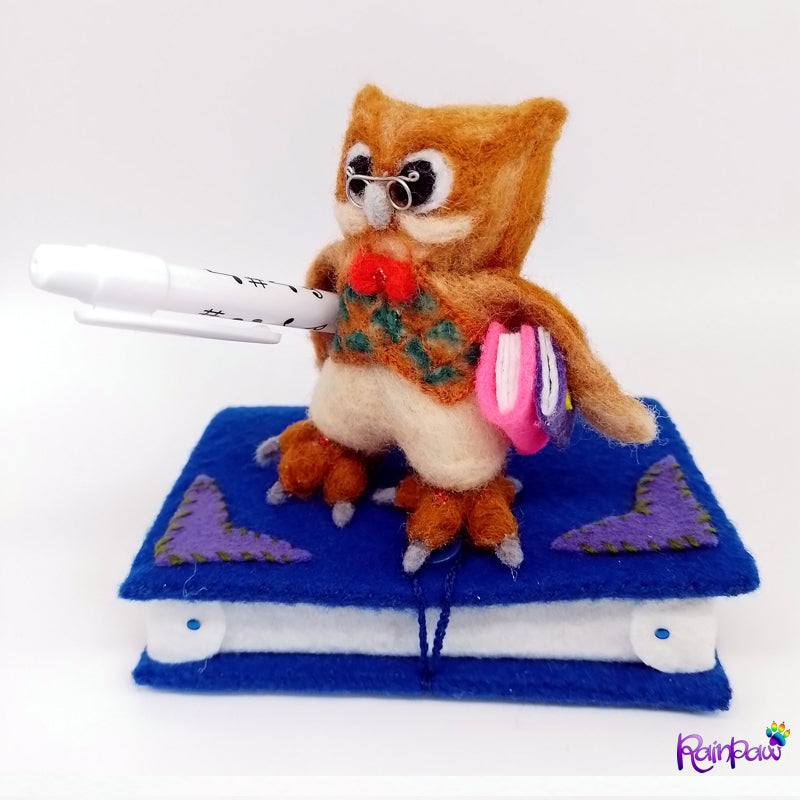 opposite wing - In this picture he owl with its smart gilet sports  two small books under the other wing