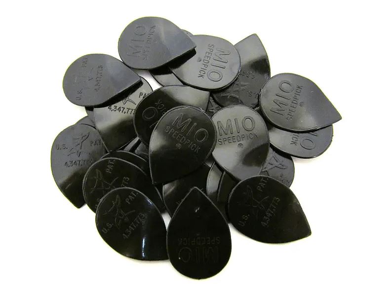 Collection of black guitar picks with 'MIO' branding on a white background