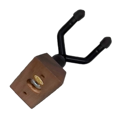 a slant view that shows the screw that attaches the metallic part of the stand to the wooden block that attaches to the wall
