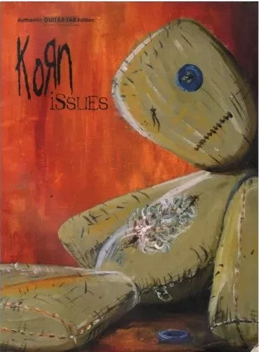 Album cover of Korn's 'Issues' with a voodoo doll and red background