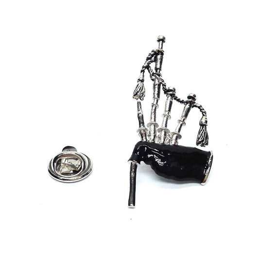 Bagpipe-shaped lapel pin on a white background