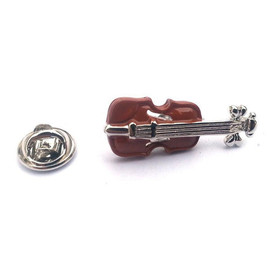 Violin-shaped brooch on a white background