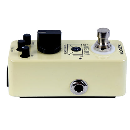 Guitar effects pedal with control knobs and a footswitch on a white background