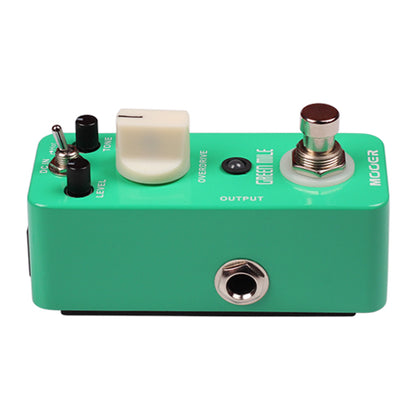 Green guitar effects pedal with various controls on a white background