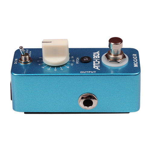 Blue guitar effects pedal with control knobs and switches on a white background