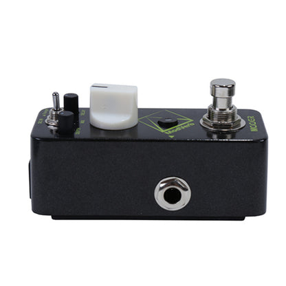 Black guitar effects pedal with various controls on a white background