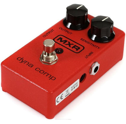 Red MXR dyna comp guitar effects pedal on a white background