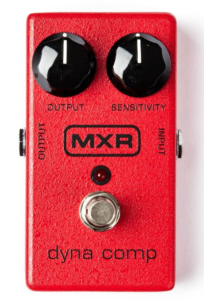 Red MXR dyna comp guitar effects pedal on a white background