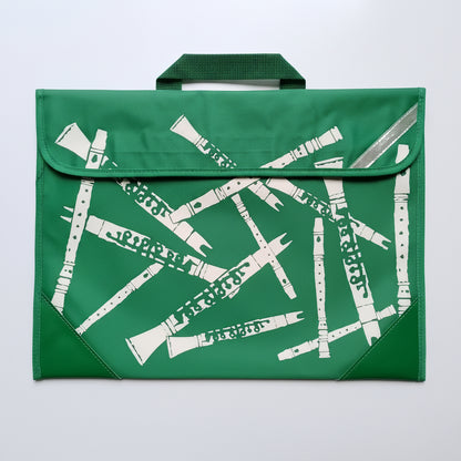 A green fabric music-themed pouch or bag with a top handle, featuring Descants musical instruments in white. The bag has green corner panels and a reflective silver-grey diagonal stripe near the top right.